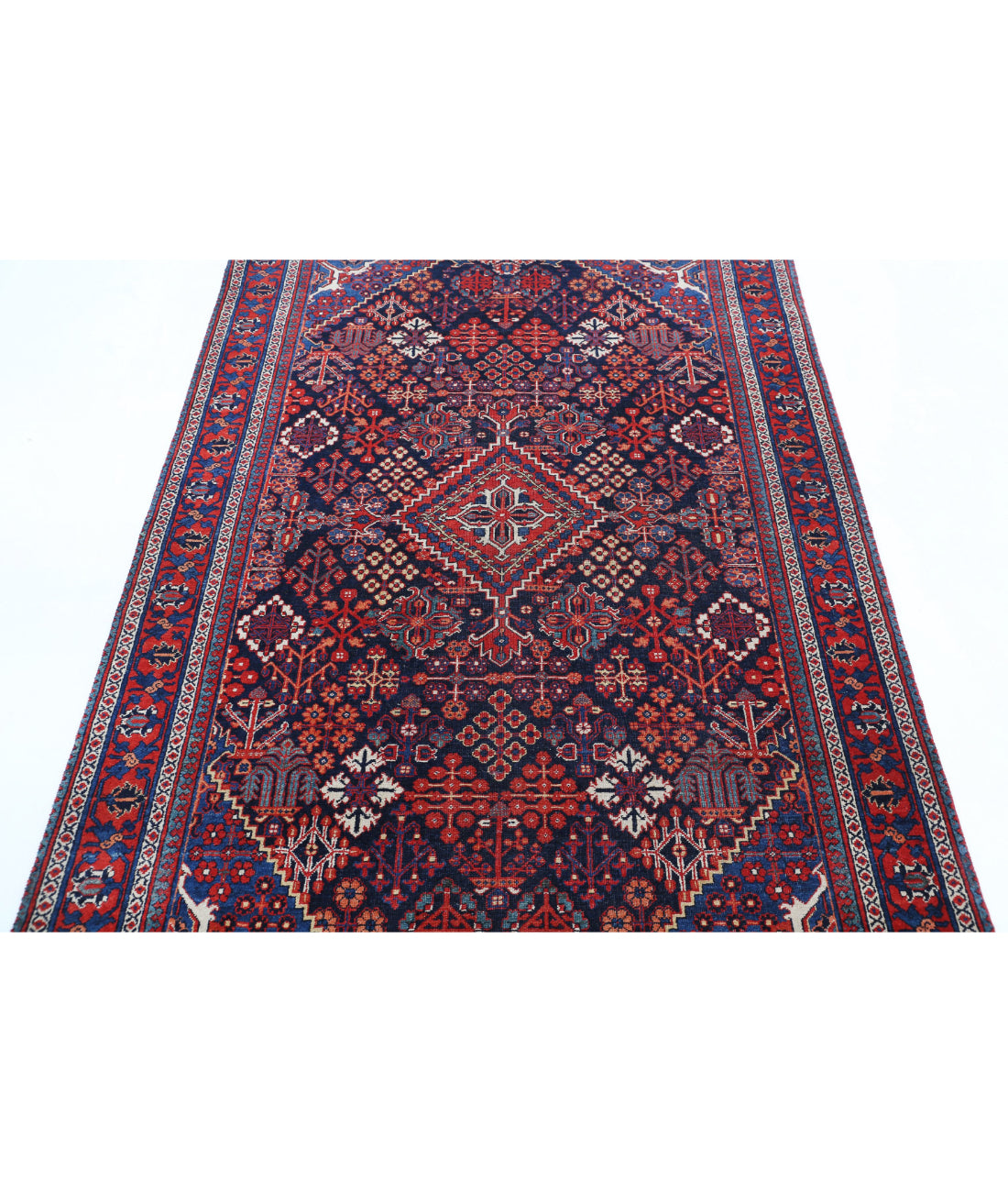 Josheghan 4'5'' X 6'8'' Hand-Knotted Wool Rug 4'5'' x 6'8'' (133 X 200) / Blue / Red
