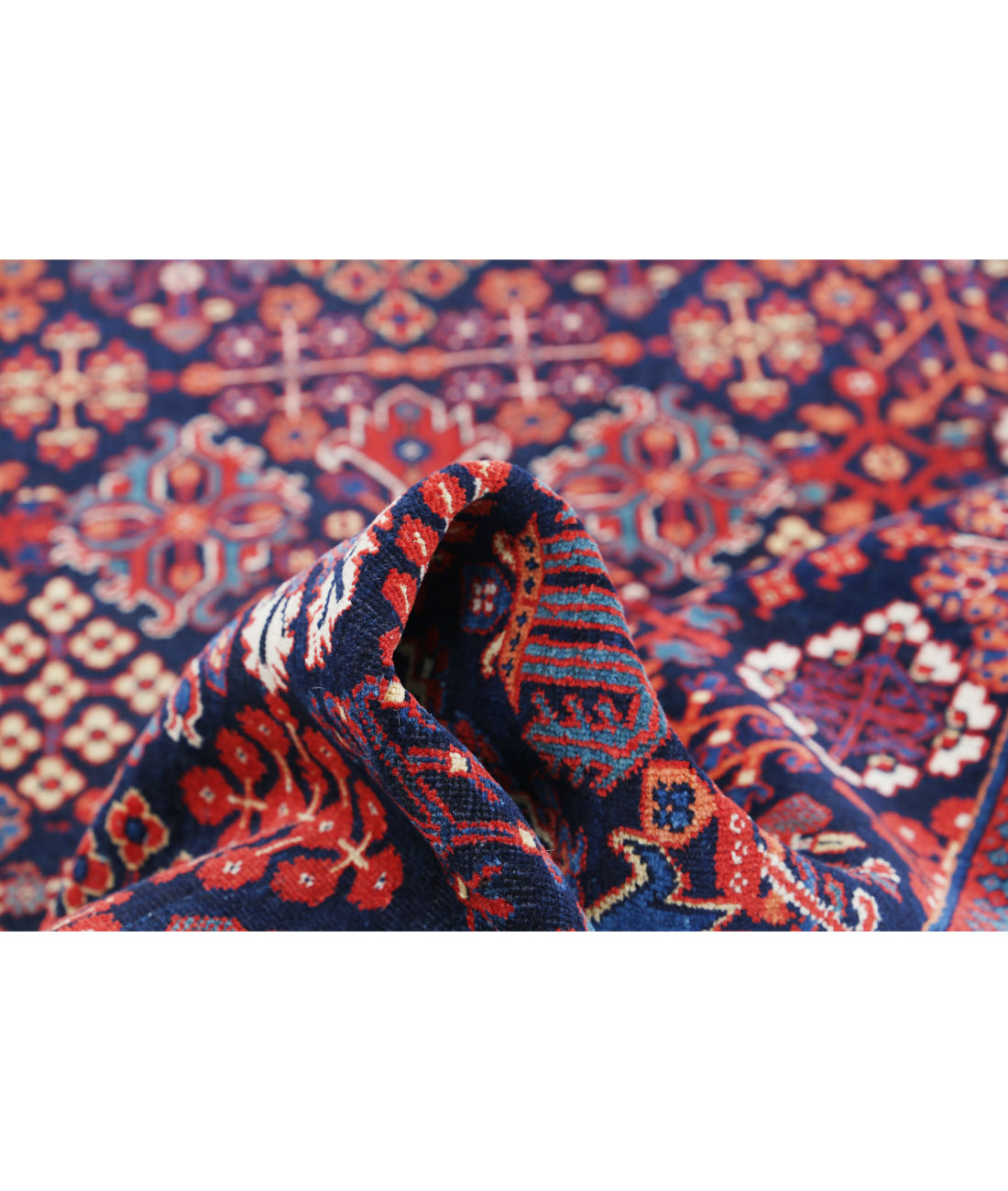 Josheghan 4'5'' X 6'8'' Hand-Knotted Wool Rug 4'5'' x 6'8'' (133 X 200) / Blue / Red
