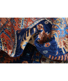 Humna 5'9'' X 8'10'' Hand-Knotted Wool Rug 5'9'' x 8'10'' (173 X 265) / Blue / Rust