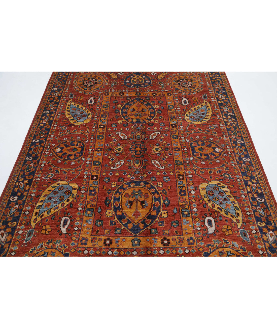 Humna 5'6'' X 7'10'' Hand-Knotted Wool Rug 5'6'' x 7'10'' (165 X 235) / Rust / Blue