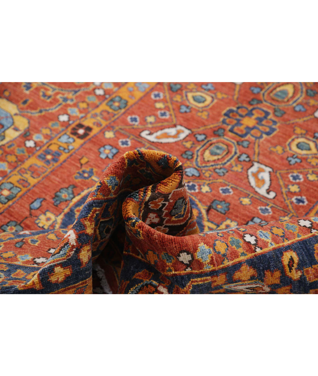 Humna 5'6'' X 7'10'' Hand-Knotted Wool Rug 5'6'' x 7'10'' (165 X 235) / Rust / Blue