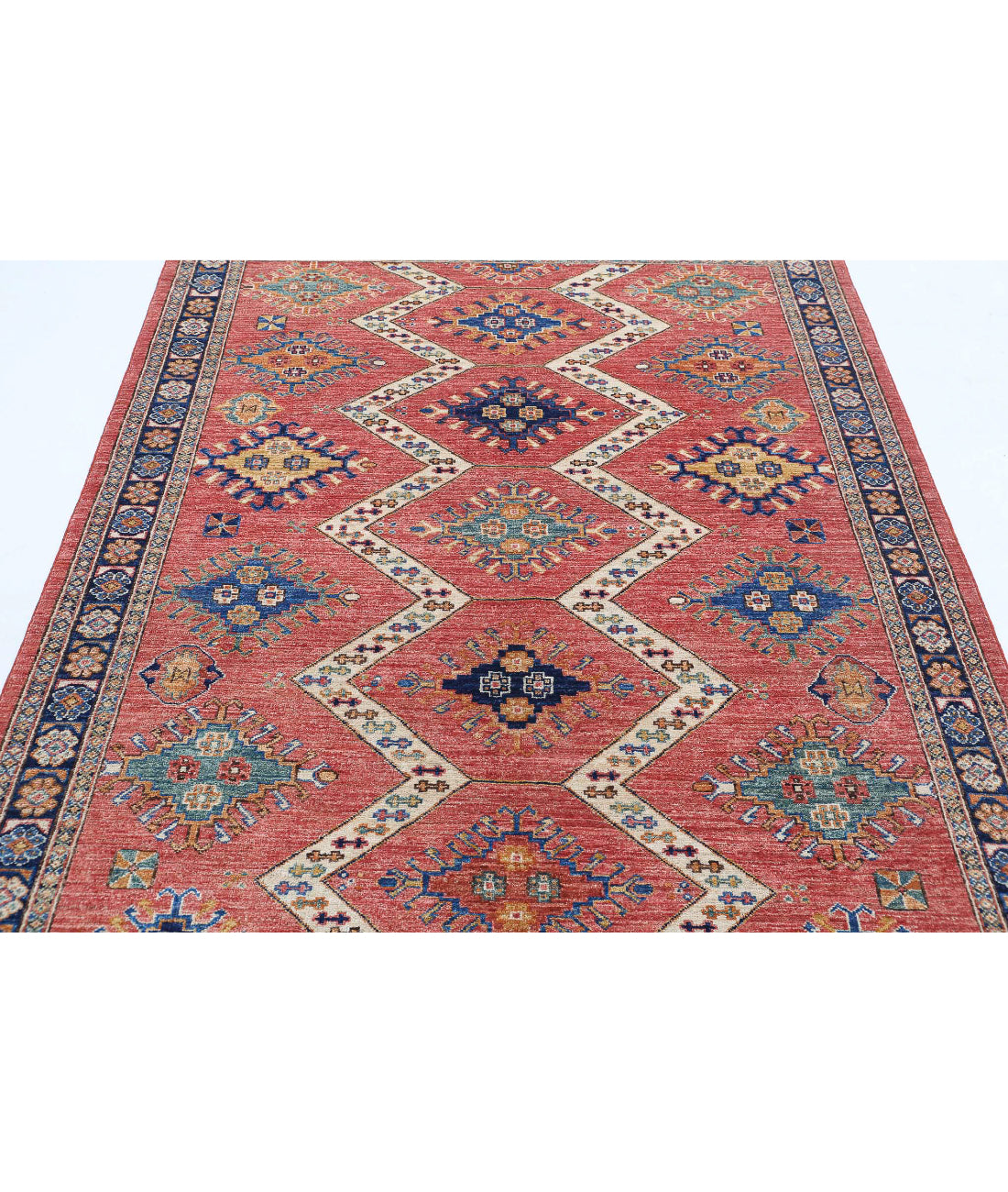 Humna 5'2'' X 7'6'' Hand-Knotted Wool Rug 5'2'' x 7'6'' (155 X 225) / Red / Blue